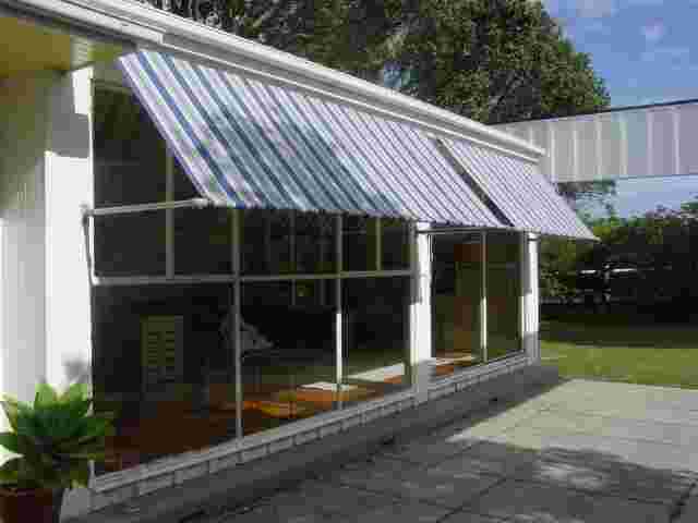 Retractable Awnings - Drop Awnings over 1970s Architectural home in Greenlane copy.JPG