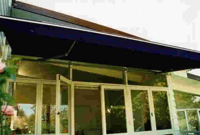 Retractable Awnings - Glass-Mounted-Folding-Arm-awning copy.jpg