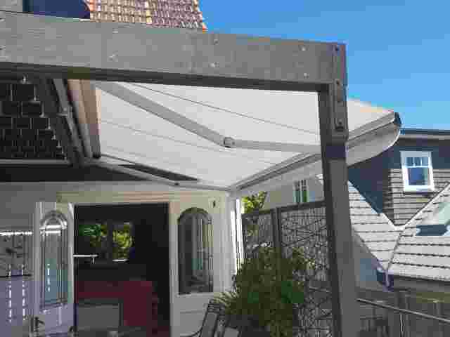 Retractable Awnings - Folding Arm Awning with white canvas over residential deck in Remuera copy.jpg