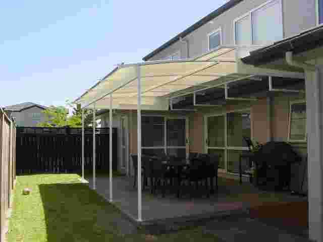 Fixed Frame Awnings - Curved Patio room over outdoor concrete patio1 copy.jpg