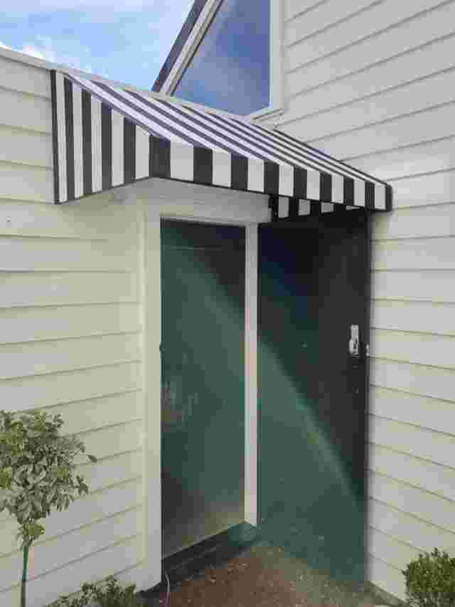 Fixed Frame Awnings - Wedge Doorway awning wih striped fabric copy.jpg
