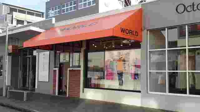 Fixed Frame Awnings - Wdge Fixed Frame awning with Orange PVC at World Newmarket copy.jpg