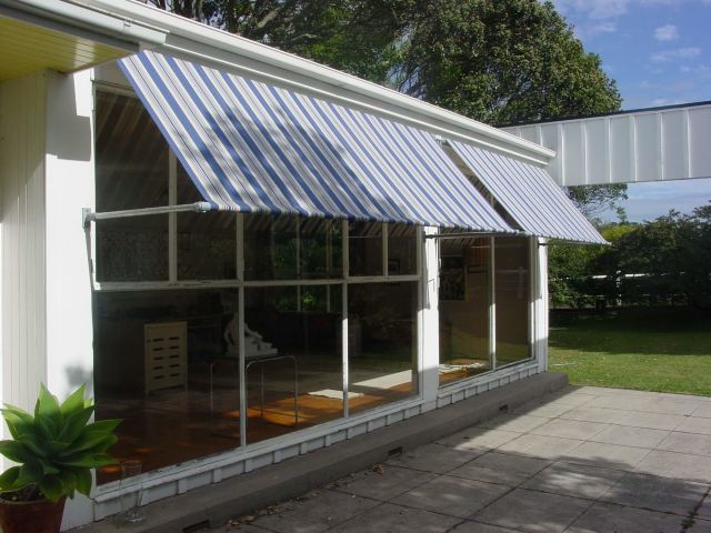Retractable Awnings - Drop Awnings over 1970s Architectural home in Greenlane copy.JPG