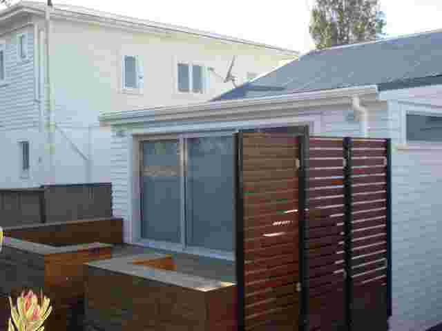 Fixed Frame Awnings - Curved Patio room BEFORE in Ellerslie copy.JPG