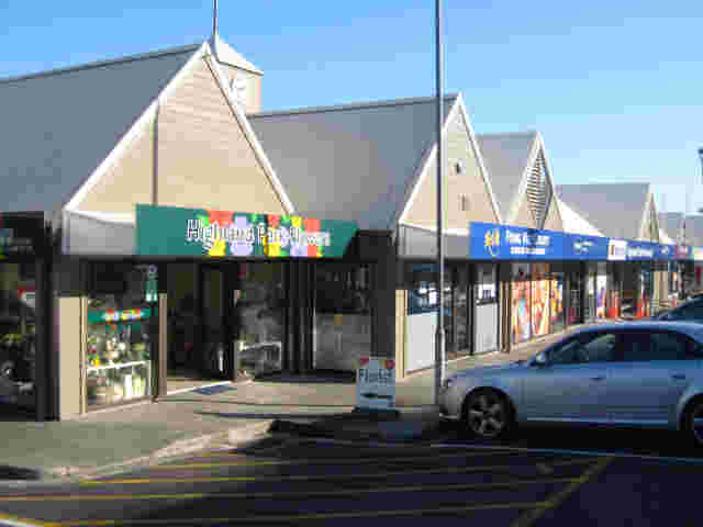 Fixed Frame Awnings - Fixed Frame Wedge awnings with signage panels on shopping centre in Auckland 1 copy.jpg