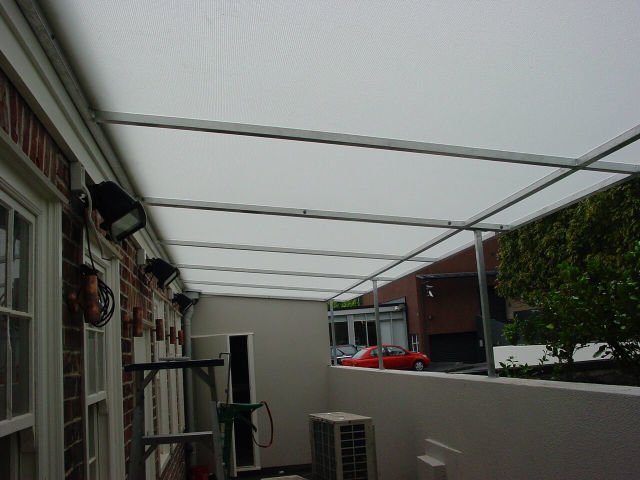 Fixed Frame Awnings - Flat Angled panel Fixed Frame awning over rear courtyard in Parnell copy.jpg