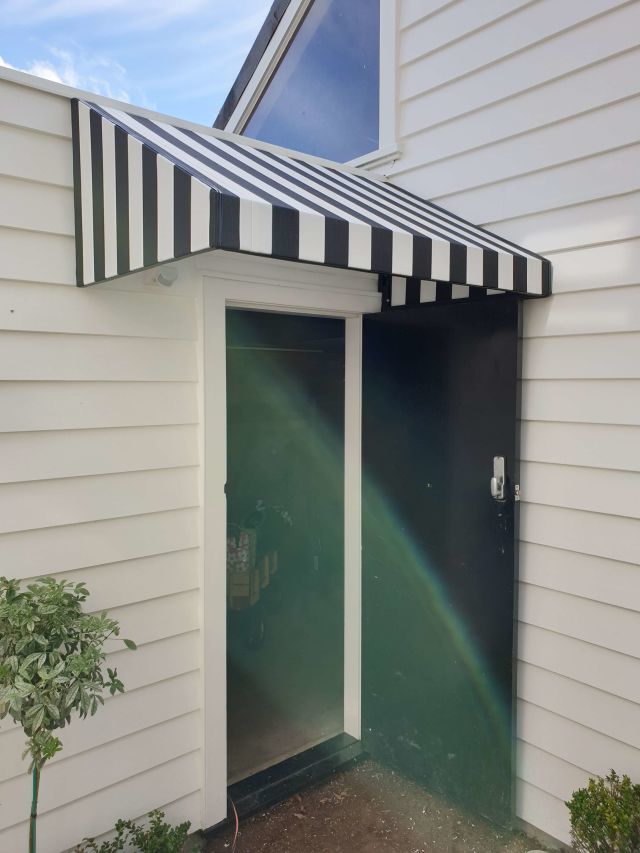 Fixed Frame Awnings - Wedge Doorway awning wih striped fabric copy.jpg