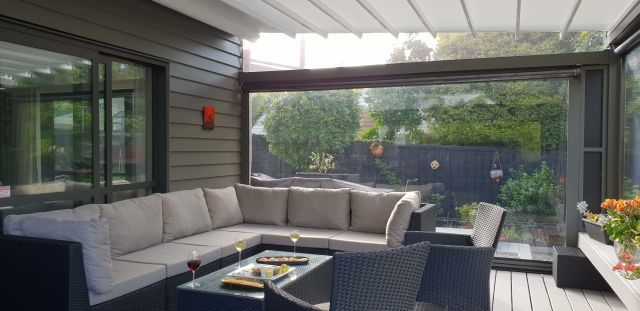 Retractable Roof - Oztech retractable roof with furniture setting in Meadowbank copy.jpg